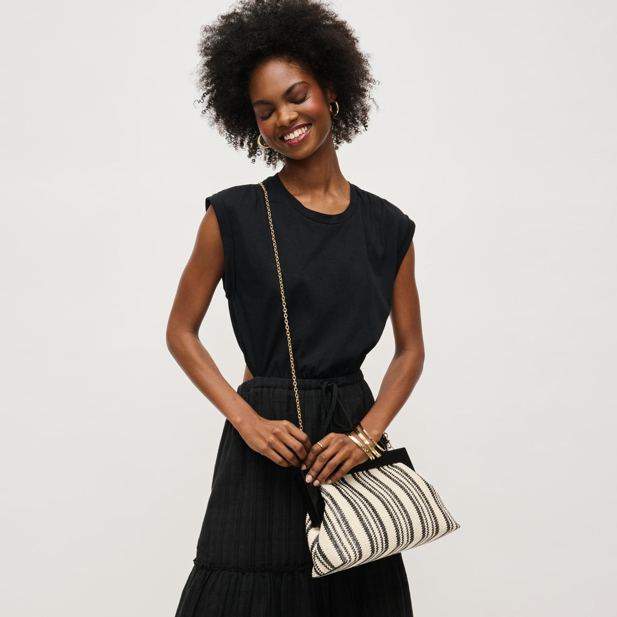 Woman wearing Black White Urban Expressions Margot Clutch 840611143655 View 3 | Black White