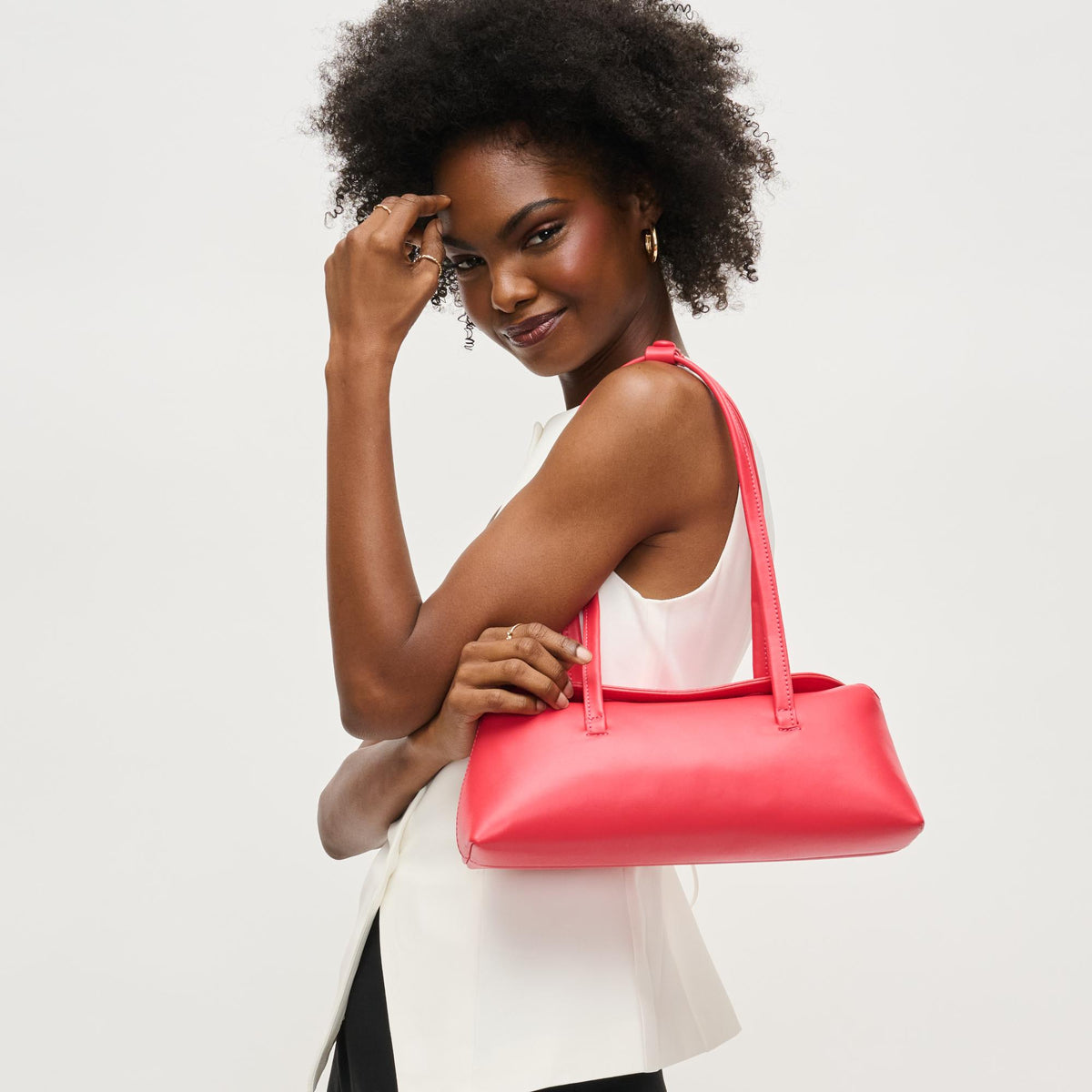 Woman wearing Coral Urban Expressions Merlinda Shoulder Bag 840611157126 View 1 | Coral