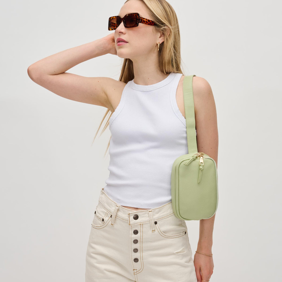 Woman wearing Sage Urban Expressions Jaxx Belt Bag 840611191731 View 2 | Sage