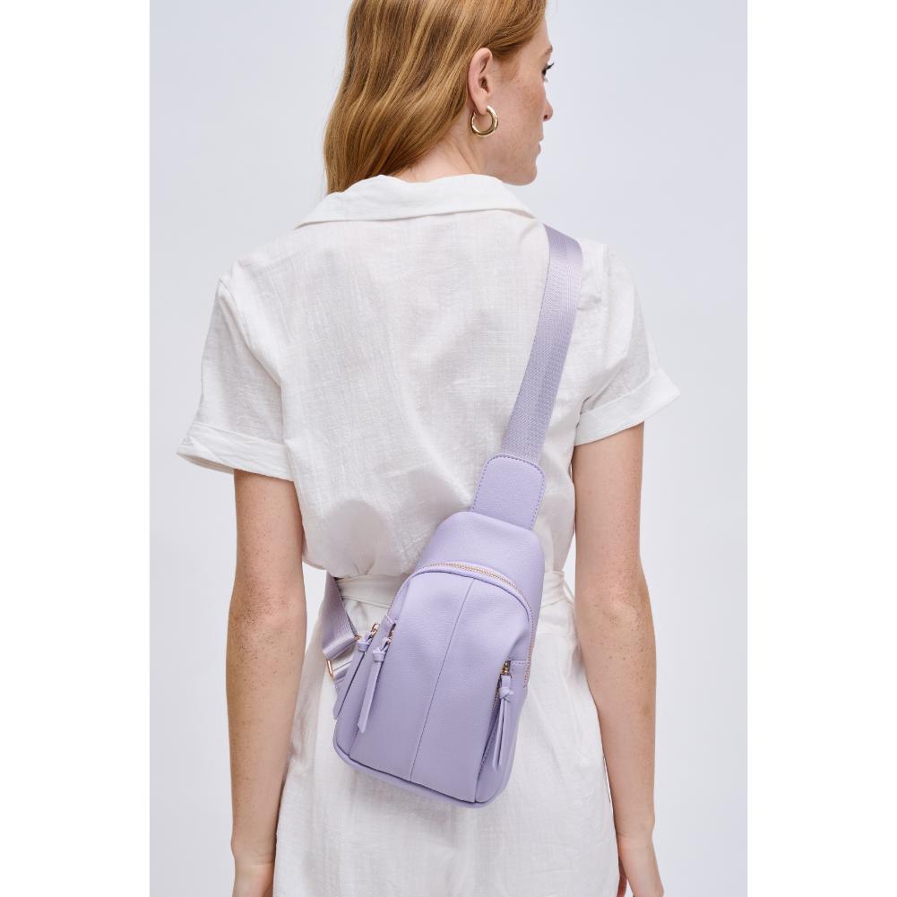 Woman wearing Lilac Urban Expressions Emille Sling Backpack 840611191588 View 3 | Lilac