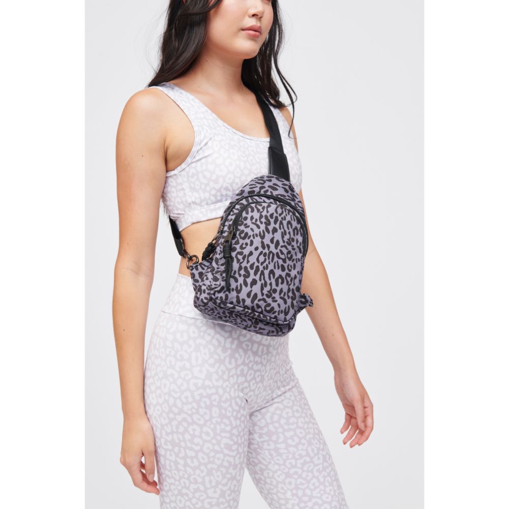 Woman wearing Grey Leopard Urban Expressions Ace Sling Backpack 840611184214 View 1 | Grey Leopard