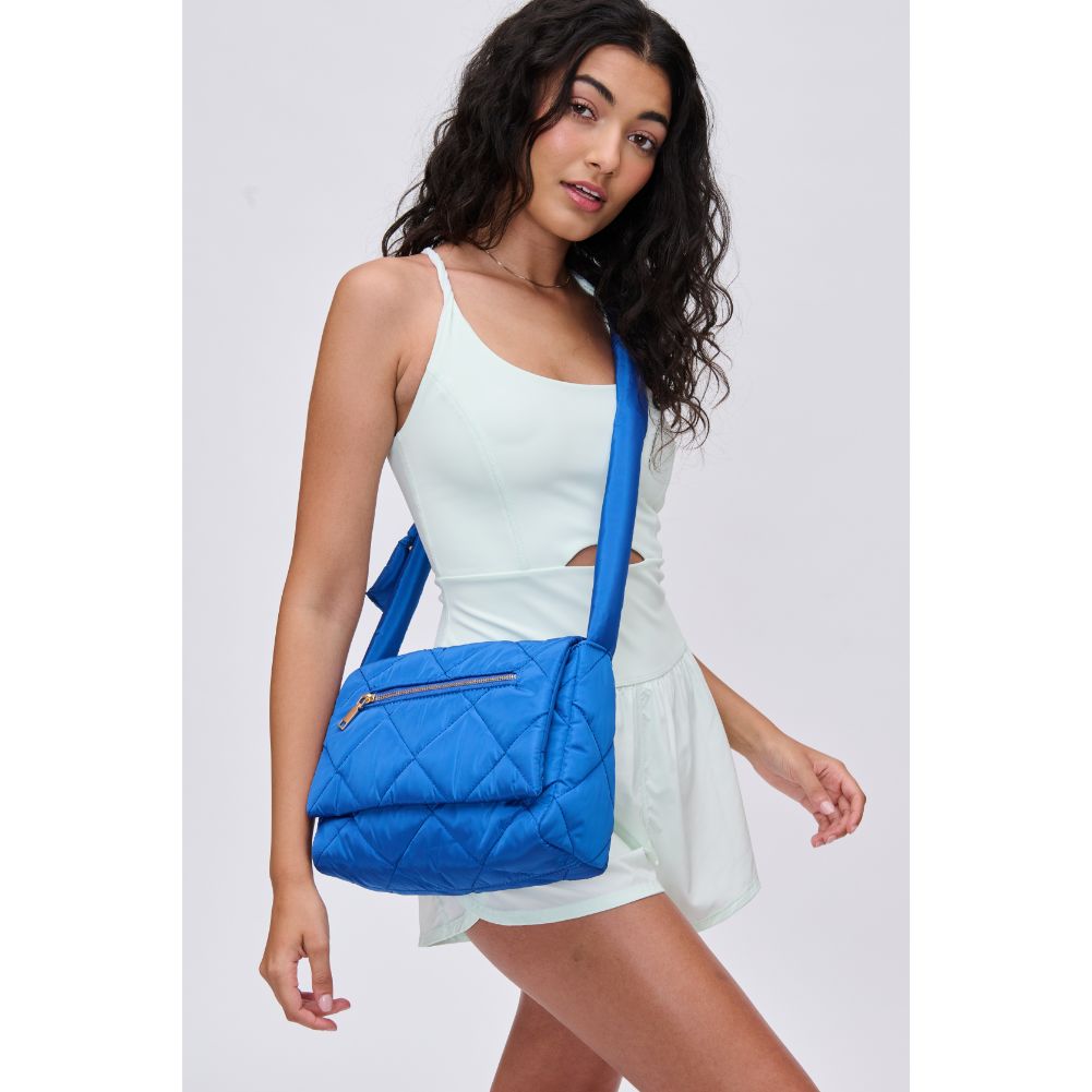 Woman wearing Cobalt Urban Expressions Carson - Quilted Nylon Crossbody 840611114495 View 2 | Cobalt