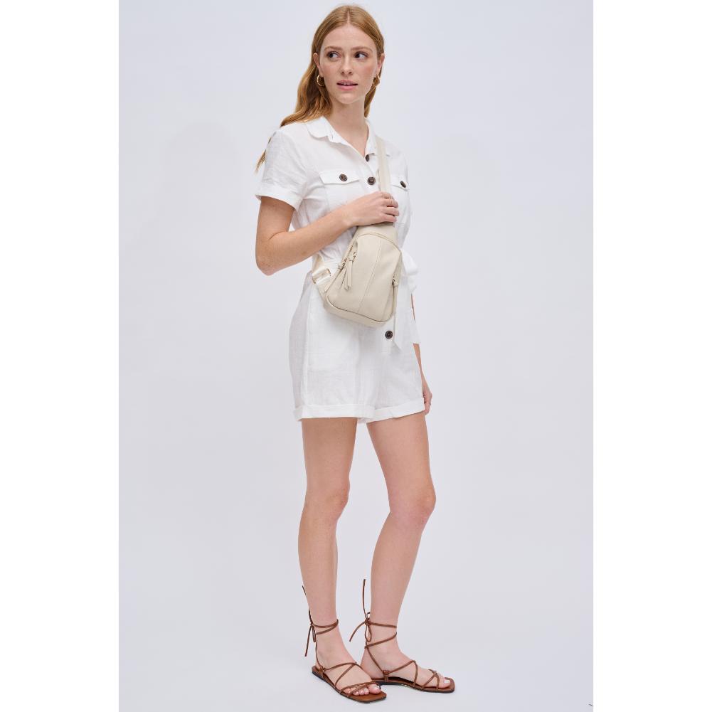 Woman wearing Ivory Urban Expressions Emille Sling Backpack 840611191564 View 3 | Ivory