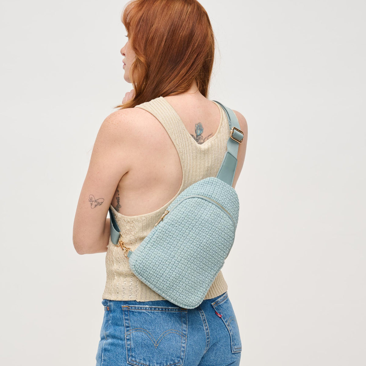 Woman wearing Blue Urban Expressions Jean Sling Backpack 840611146540 View 2 | Blue