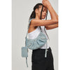 Woman wearing Denim Urban Expressions Bellatrix Denim Crossbody 840611110107 View 1 | Denim