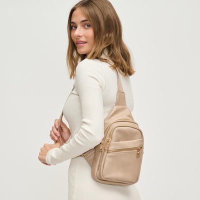 Woman wearing Natural Urban Expressions Zephyr Sling Backpack 840611193308 View 1 | Natural