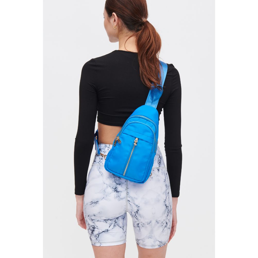 Woman wearing Ocean Urban Expressions Wagner Sling Backpack 840611108388 View 3 | Ocean