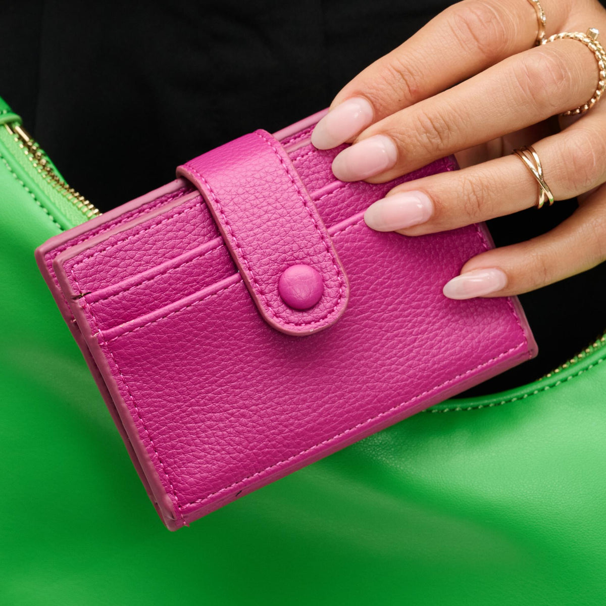 Woman wearing Fuchsia Urban Expressions Lola Card Holder 840611121684 View 1 | Fuchsia