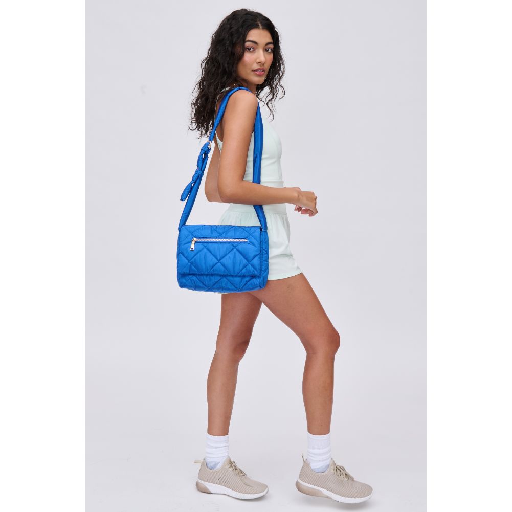 Woman wearing Cobalt Urban Expressions Carson - Quilted Nylon Crossbody 840611114495 View 3 | Cobalt