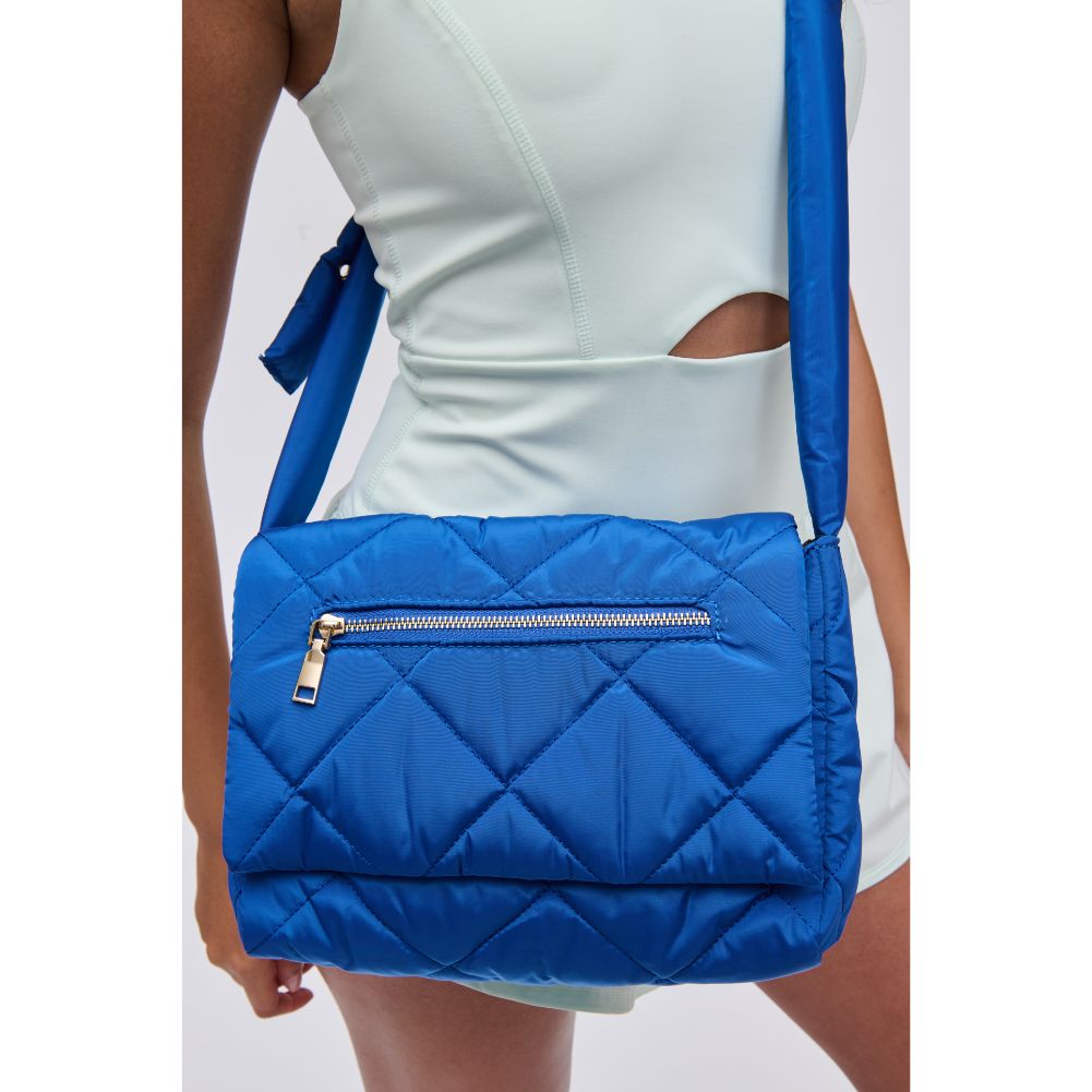 Woman wearing Cobalt Urban Expressions Carson - Quilted Nylon Crossbody 840611114495 View 4 | Cobalt