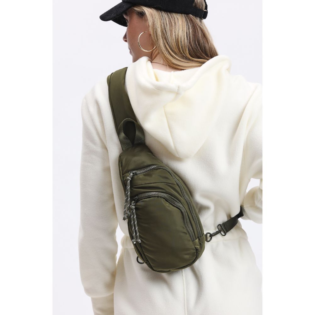 Woman wearing Olive Urban Expressions Parc Sling Backpack 840611114440 View 1 | Olive