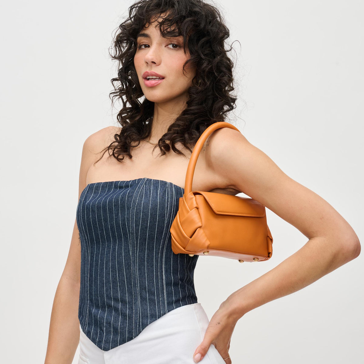 Woman wearing Tangerine Urban Expressions Devin Crossbody 840611192042 View 2 | Tangerine