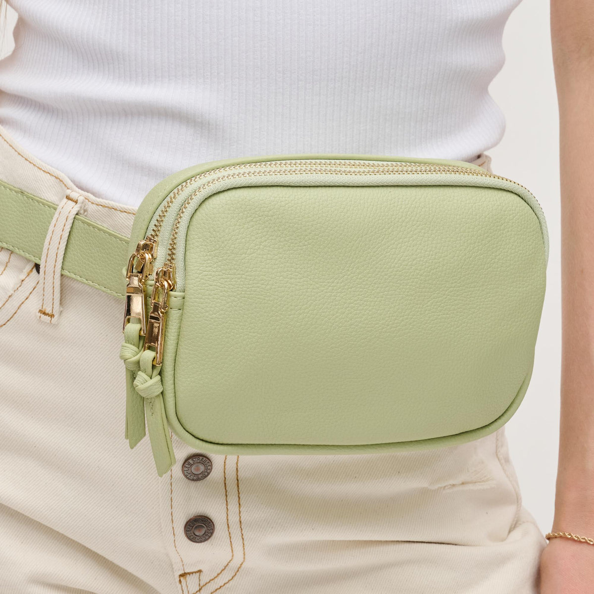 Woman wearing Sage Urban Expressions Jaxx Belt Bag 840611191731 View 4 | Sage