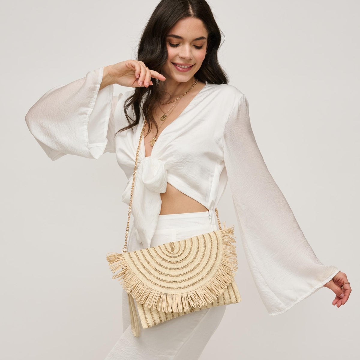 Woman wearing Ivory Gold Urban Expressions Katie Clutch 840611156914 View 3 | Ivory Gold