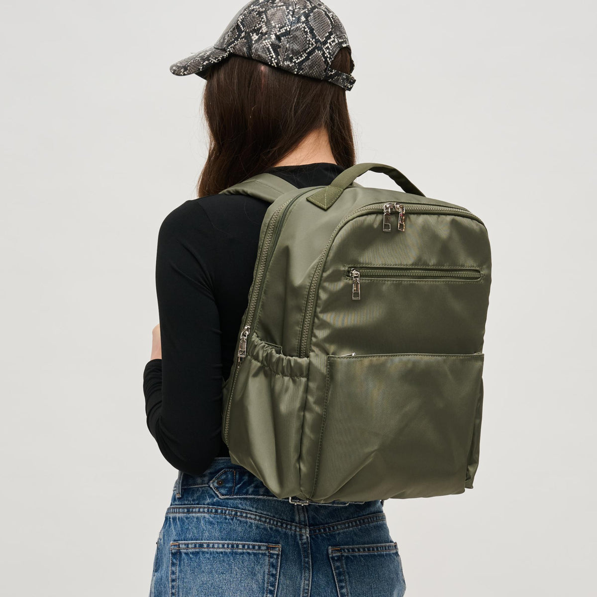 Woman wearing Olive Urban Expressions Urban Explorer Backpack 840611195371 View 1 | Olive