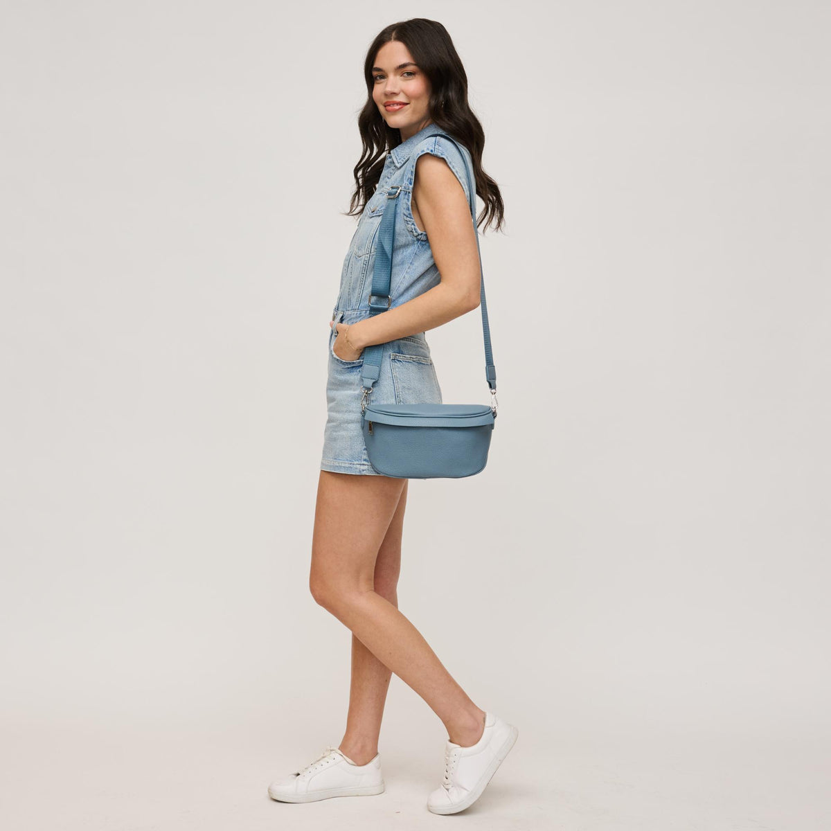 Woman wearing Denim Urban Expressions Laney Belt Bag 840611146502 View 4 | Denim