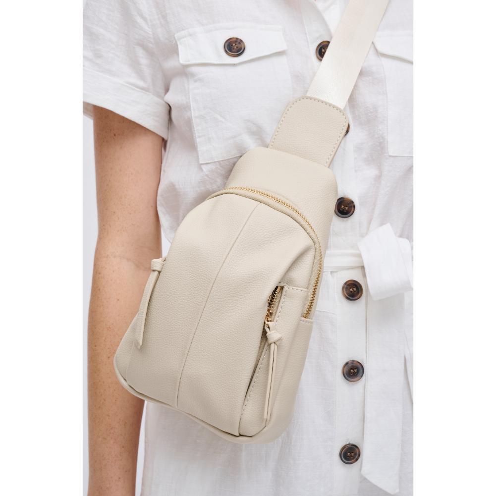 Woman wearing Ivory Urban Expressions Emille Sling Backpack 840611191564 View 4 | Ivory