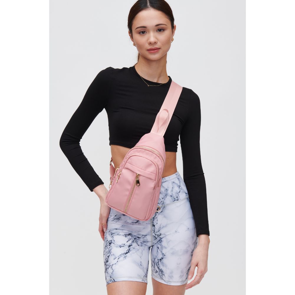 Woman wearing Blush Urban Expressions Wagner Sling Backpack 840611108357 View 1 | Blush