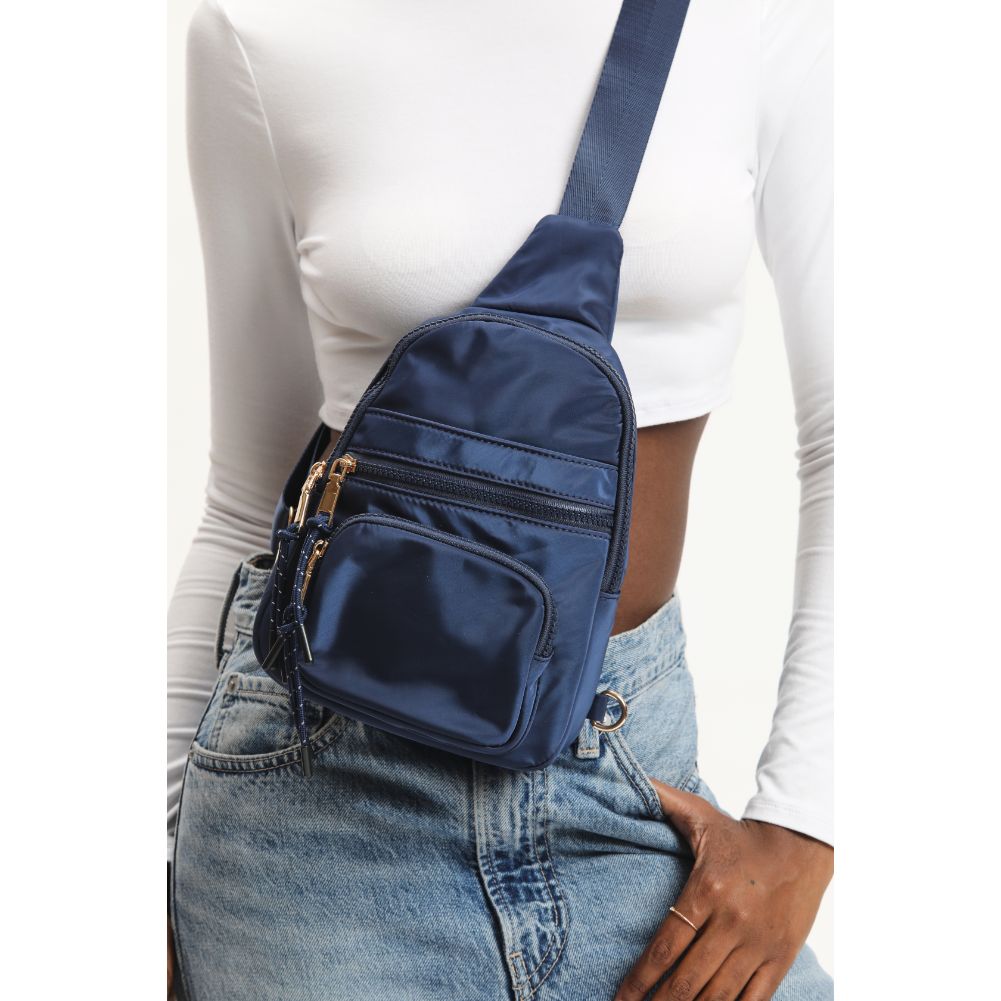 Woman wearing Navy Urban Expressions Sid Sling Backpack 840611120694 View 4 | Navy