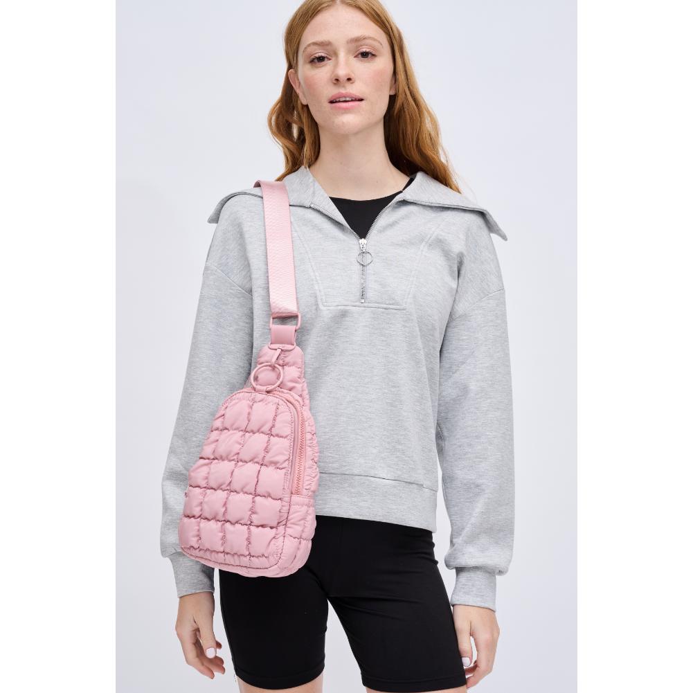 Woman wearing Rose Urban Expressions Bristol Sling Backpack 840611128355 View 1 | Rose