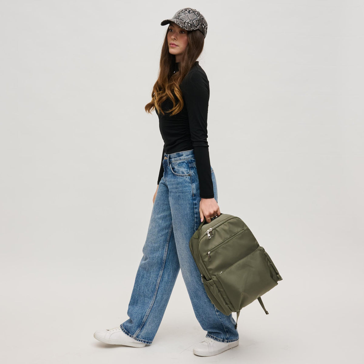 Woman wearing Olive Urban Expressions Urban Explorer Backpack 840611195371 View 3 | Olive