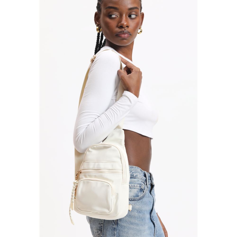 Woman wearing Ivory Urban Expressions Sid Sling Backpack 840611120700 View 3 | Ivory