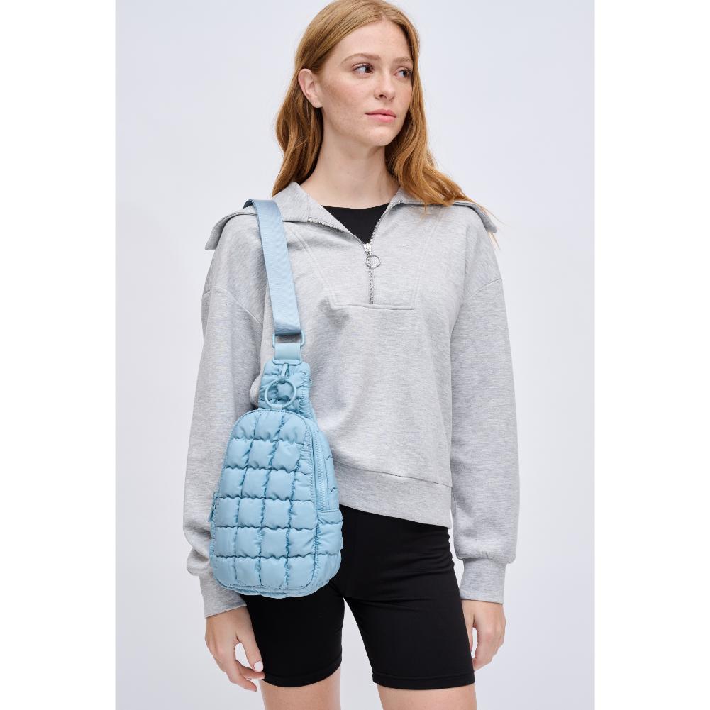 Woman wearing Sky Blue Urban Expressions Bristol Sling Backpack 840611128331 View 3 | Sky Blue