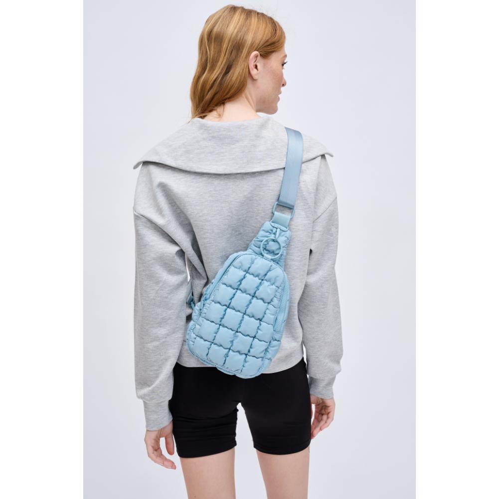 Woman wearing Sky Blue Urban Expressions Bristol Sling Backpack 840611128331 View 2 | Sky Blue