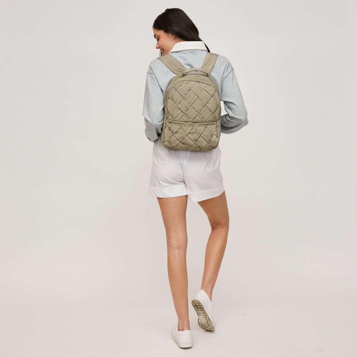 Woman wearing Sage Urban Expressions Robin Backpack 840611146465 View 3 | Sage