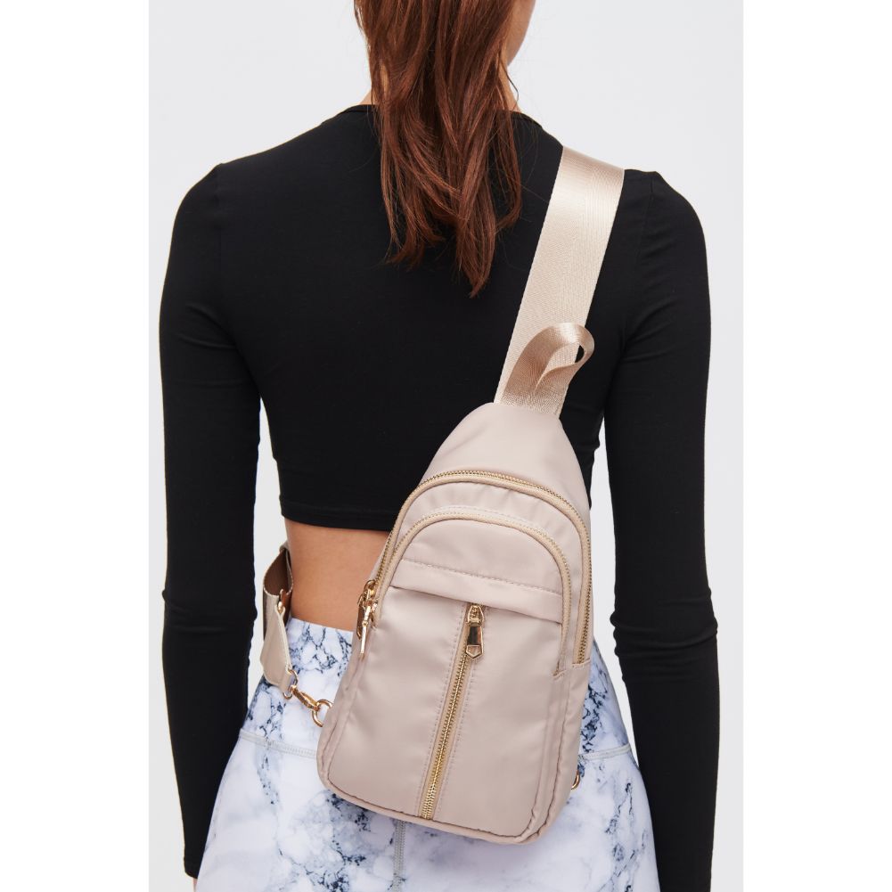 Woman wearing Natural Urban Expressions Wagner Sling Backpack 840611108371 View 1 | Natural