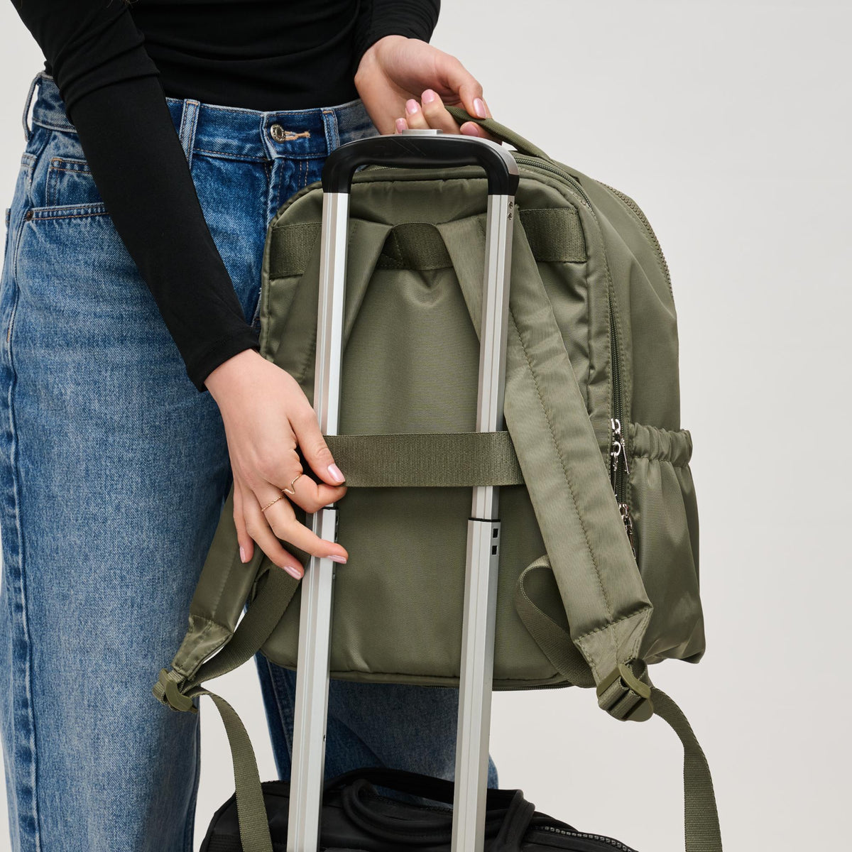 Woman wearing Olive Urban Expressions Urban Explorer Backpack 840611195371 View 4 | Olive