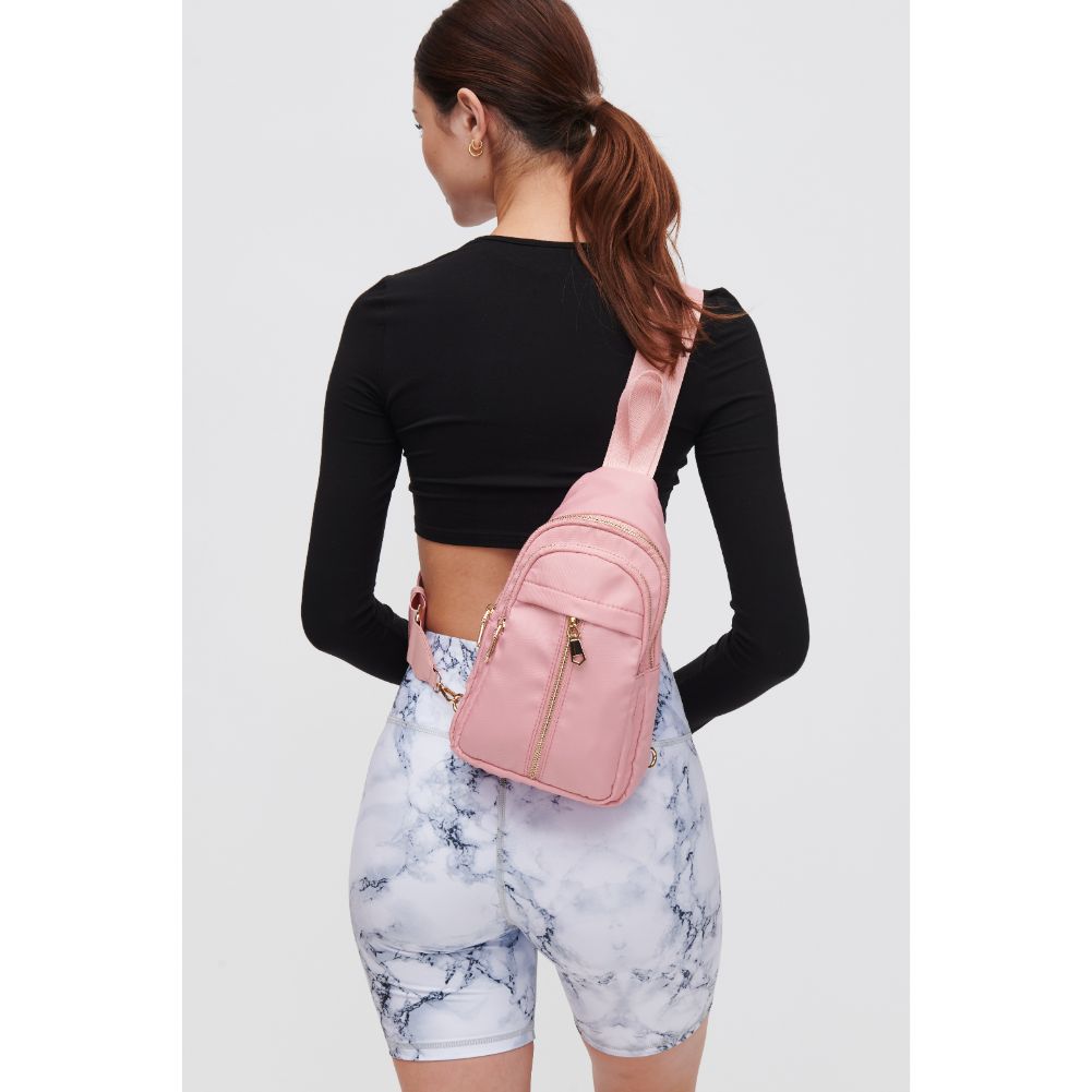 Woman wearing Blush Urban Expressions Wagner Sling Backpack 840611108357 View 3 | Blush