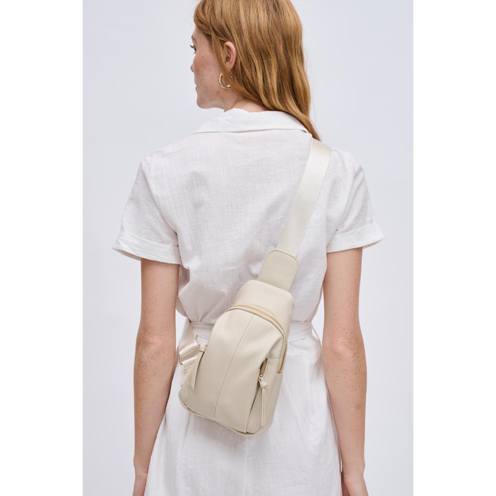 Woman wearing Ivory Urban Expressions Emille Sling Backpack 840611191564 View 2 | Ivory