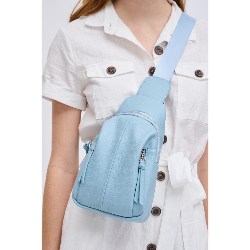 Woman wearing Sky Blue Urban Expressions Emille Sling Backpack 840611191557 View 1 | Sky Blue