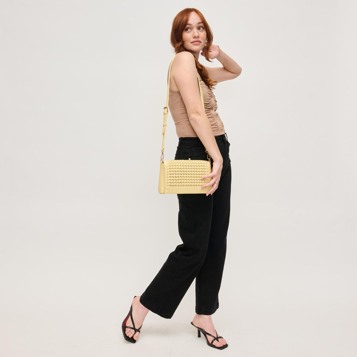 Woman wearing Butter Urban Expressions Nina Crossbody 840611144546 View 2 | Butter