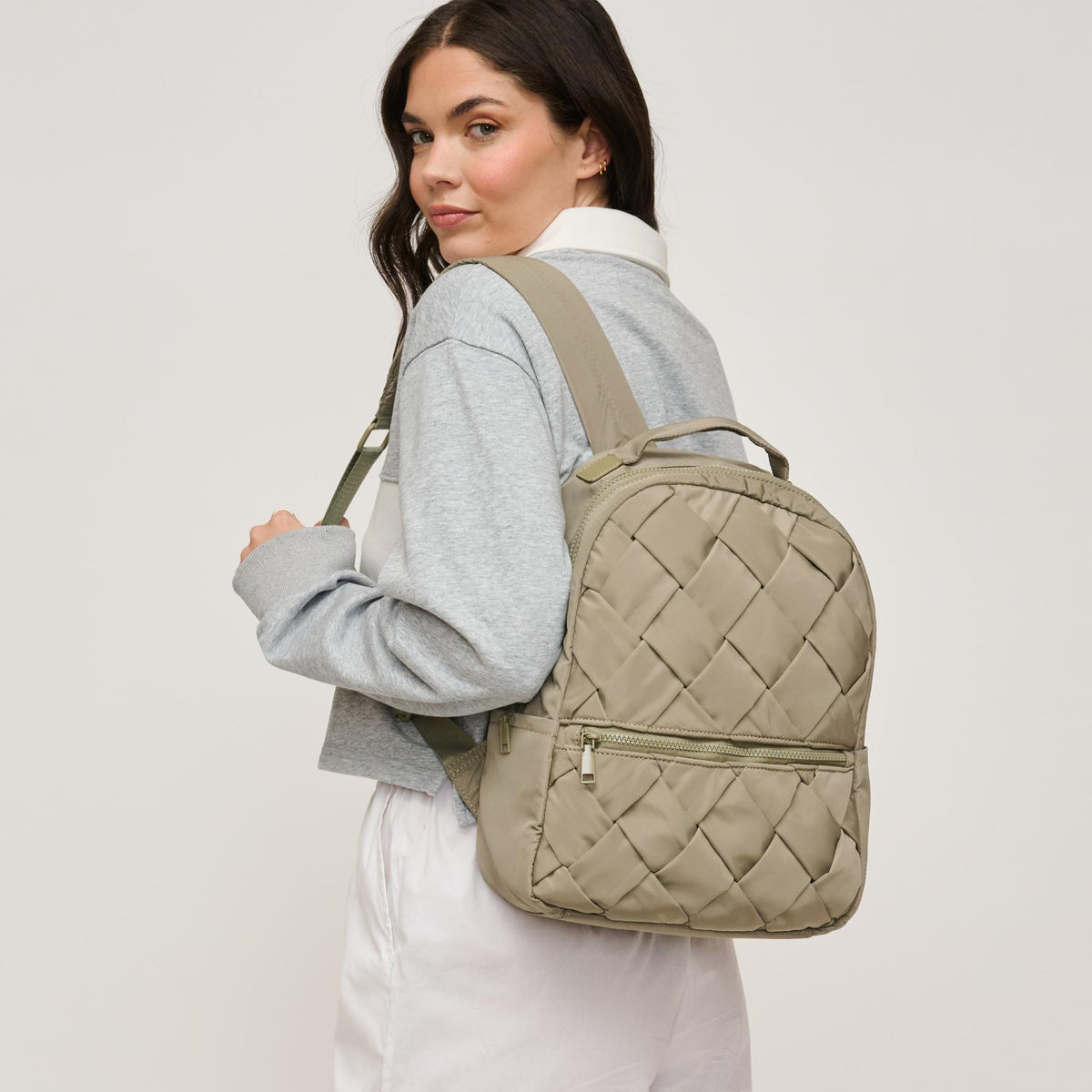 Woman wearing Sage Urban Expressions Robin Backpack 840611146465 View 2 | Sage