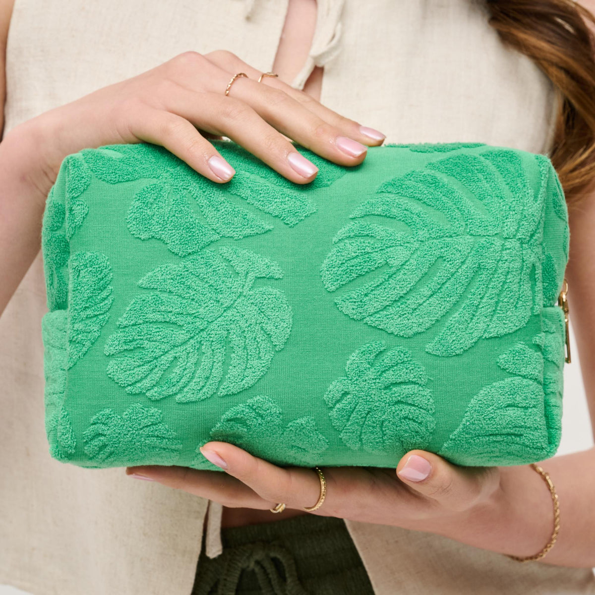 Woman wearing Green Urban Expressions Palm Breeze Cosmetic Pouch 840611195340 View 1 | Green