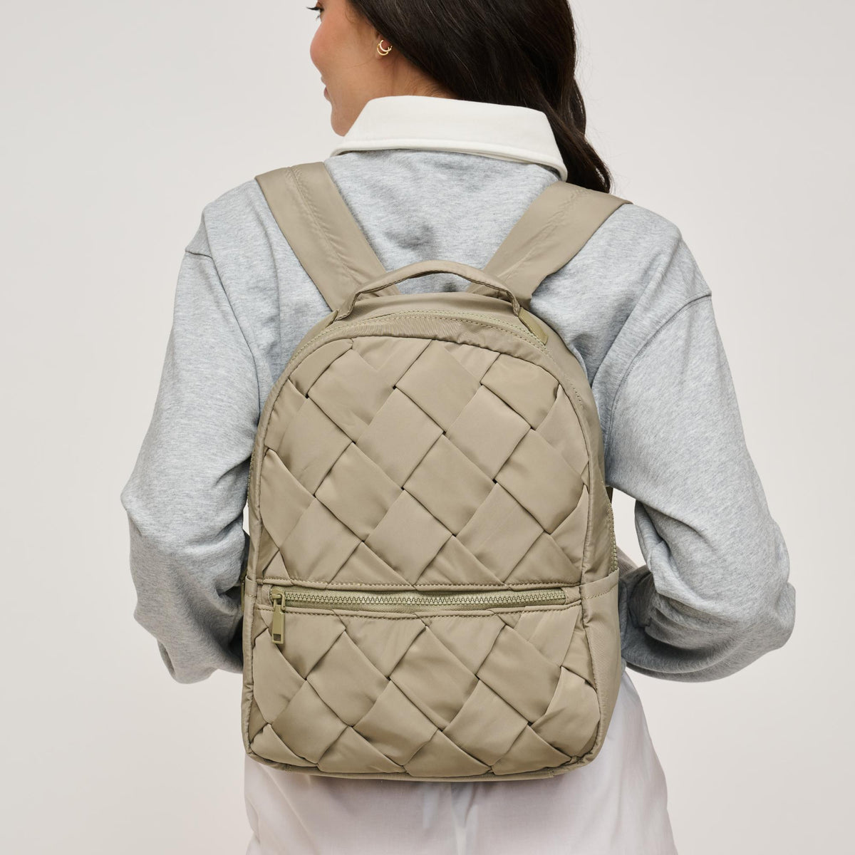 Woman wearing Sage Urban Expressions Robin Backpack 840611146465 View 1 | Sage