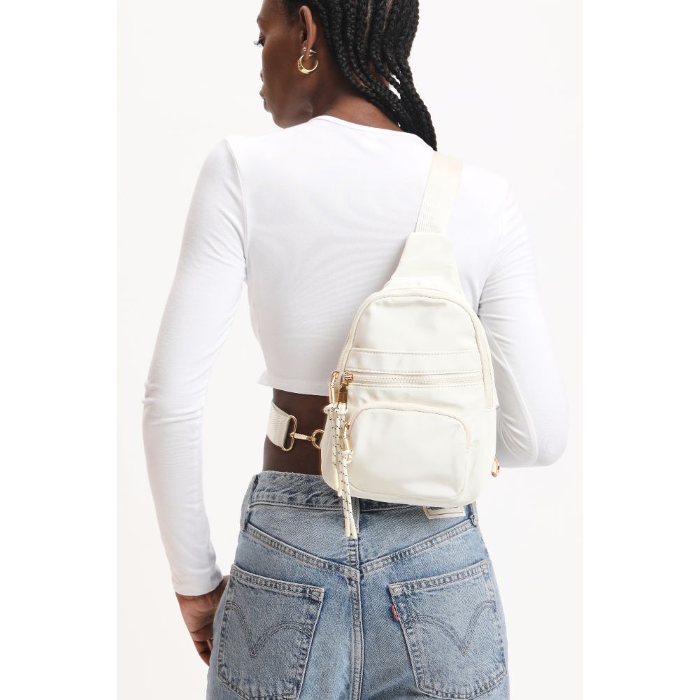 Woman wearing Ivory Urban Expressions Sid Sling Backpack 840611120700 View 2 | Ivory