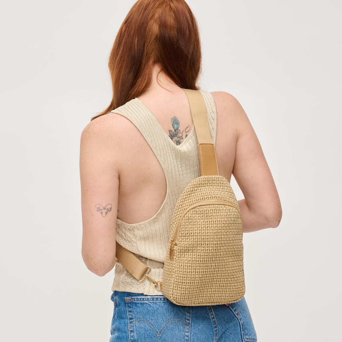 Woman wearing Natural Urban Expressions Jean Sling Backpack 840611146533 View 2 | Natural