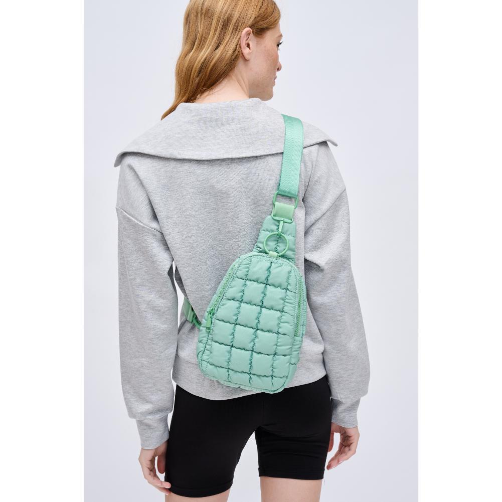 Woman wearing Pistachio Urban Expressions Bristol Sling Backpack 840611128362 View 2 | Pistachio