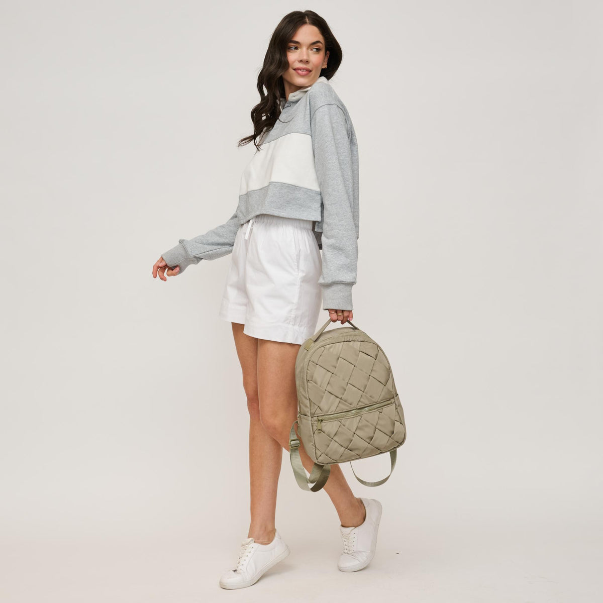 Woman wearing Sage Urban Expressions Robin Backpack 840611146465 View 4 | Sage