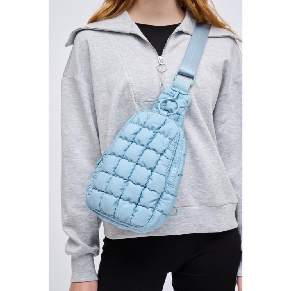 Woman wearing Sky Blue Urban Expressions Bristol Sling Backpack 840611128331 View 1 | Sky Blue