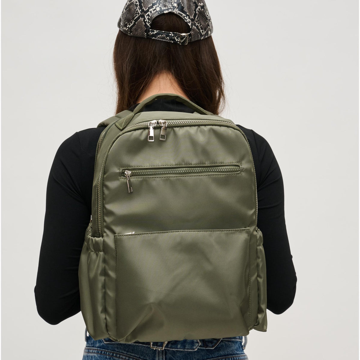 Woman wearing Olive Urban Expressions Urban Explorer Backpack 840611195371 View 2 | Olive