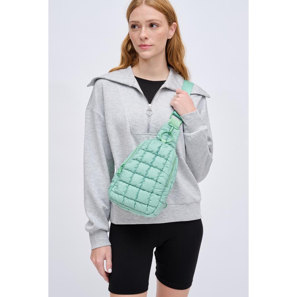 Woman wearing Pistachio Urban Expressions Bristol Sling Backpack 840611128362 View 1 | Pistachio