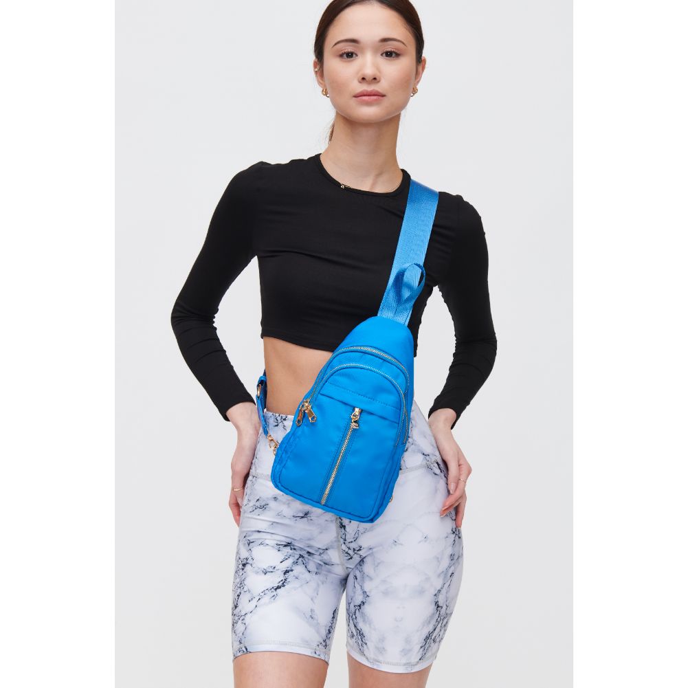 Woman wearing Ocean Urban Expressions Wagner Sling Backpack 840611108388 View 1 | Ocean