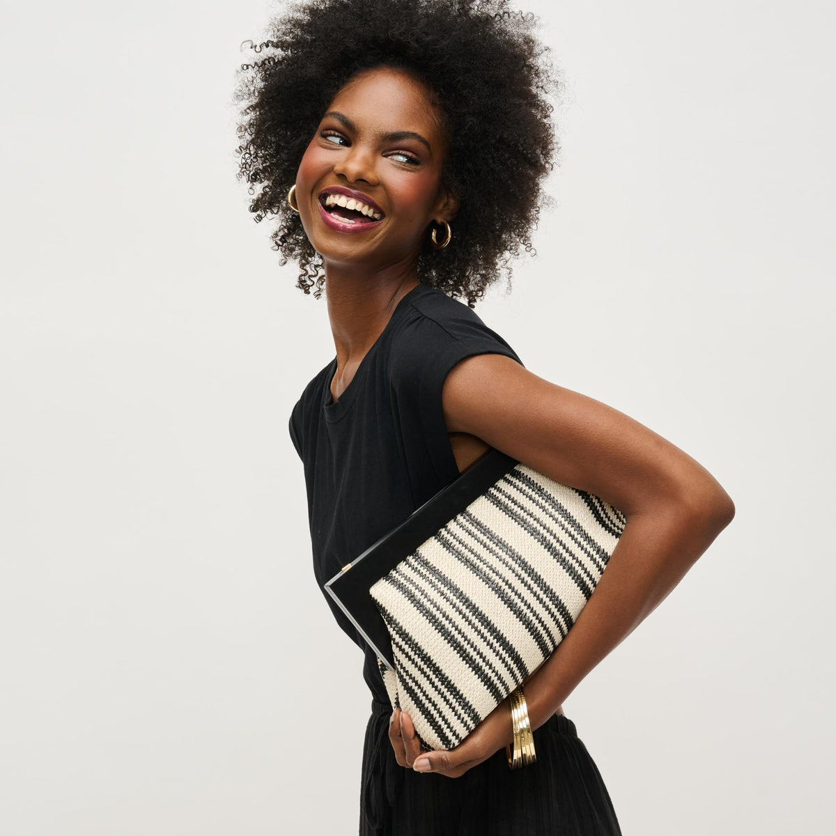 Woman wearing Black White Urban Expressions Margot Clutch 840611143655 View 2 | Black White