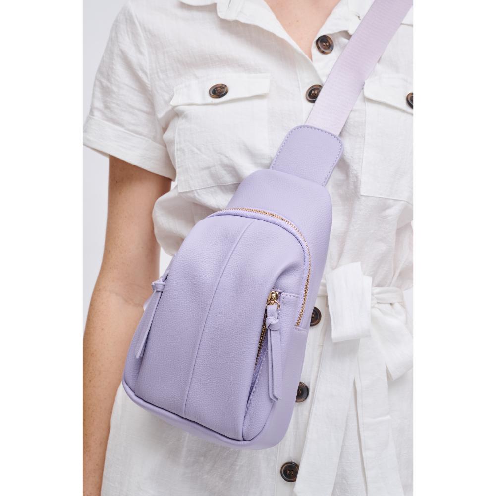 Woman wearing Lilac Urban Expressions Emille Sling Backpack 840611191588 View 1 | Lilac