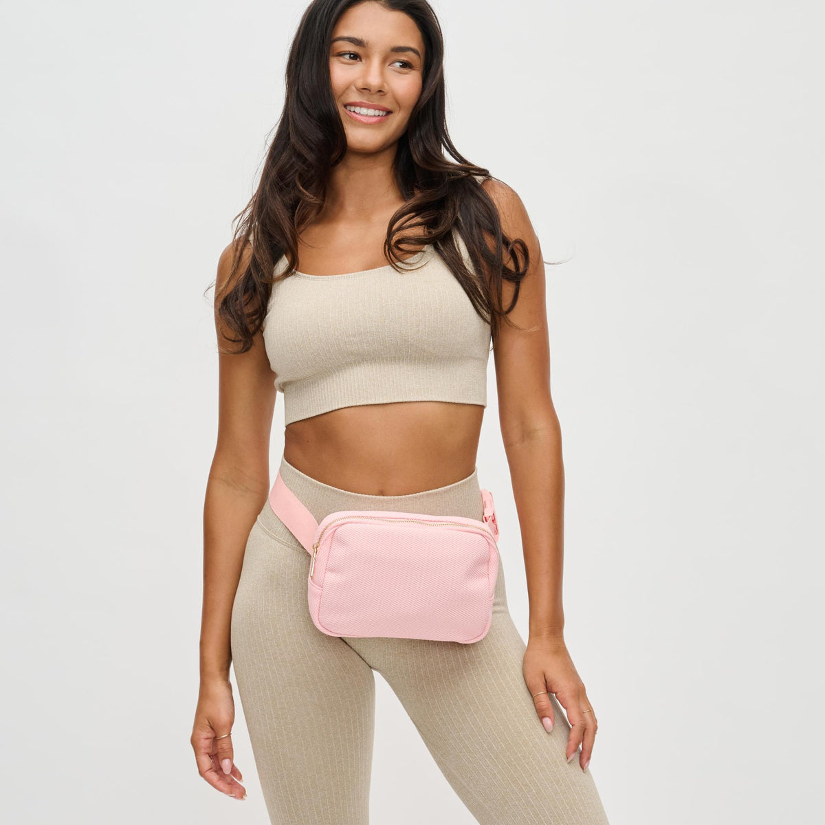 Woman wearing Blush Urban Expressions Felix Belt Bag 840611122735 View 1 | Blush