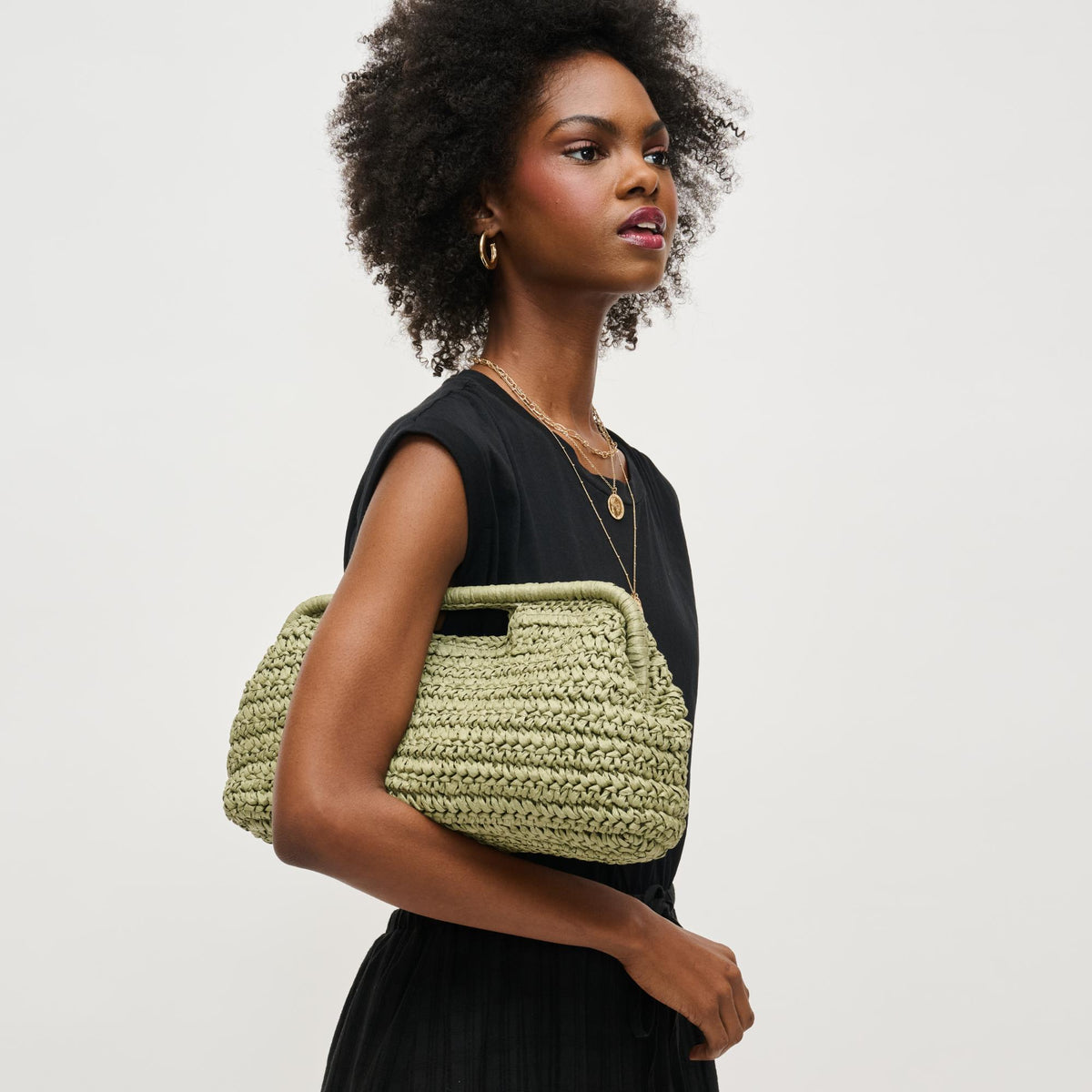 Woman wearing Sage Urban Expressions Lani Clutch 840611151636 View 2 | Sage